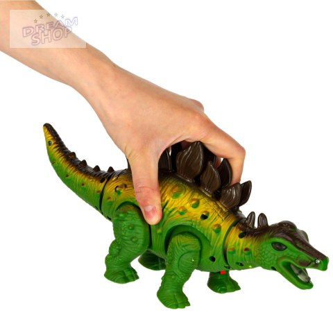 Dinozaur Stegozaur chodzi świeci ryczy